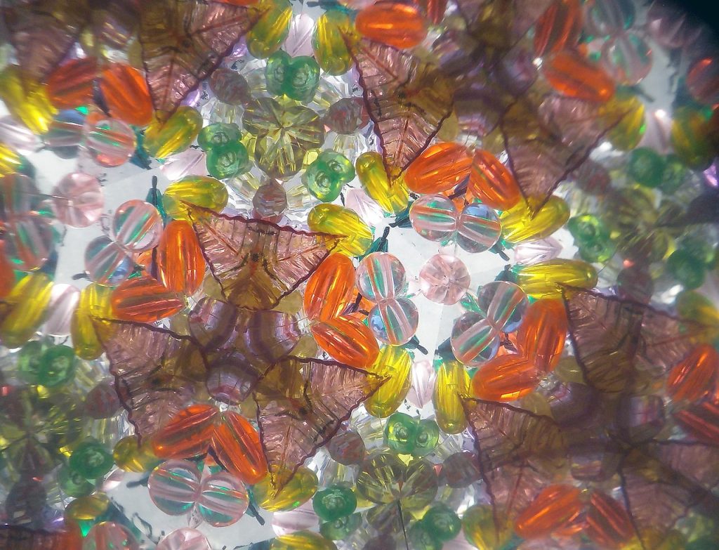 View through a kaleidoscope with coloured glass beads