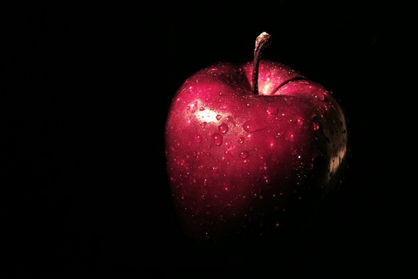 Water on the surface of this apple beads up due to the effect of surface tension. Source: “wet apple” by cristian ruberti is licensed under the Creative Commons Attribution-NonCommercial-ShareAlike 2.0 Generic.