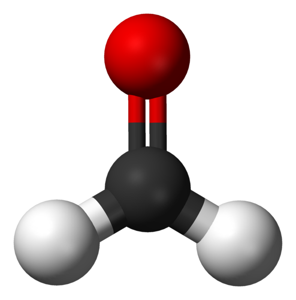 3D molecular model of formaldehyde: a large black sphere representing the carbon atom is centrally located with two smaller white spheres for hydrogen atoms at an angle and one larger red sphere for the oxygen atom positioned above the carbon, showing the trigonal planar arrangement of atoms.